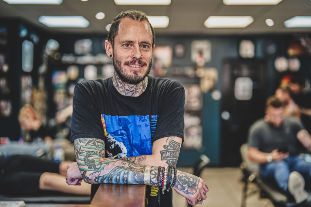 A portrait of Steven Gigli, taken by Blanc Creative inside Black Dagger Tattoo Studio Norwich