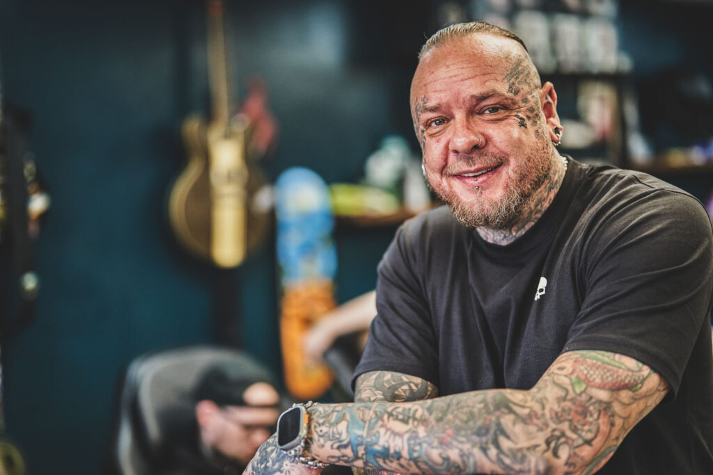 A portrait of Simon Syder, taken by Blanc Creative inside Black Dagger Tattoo Studio Norwich