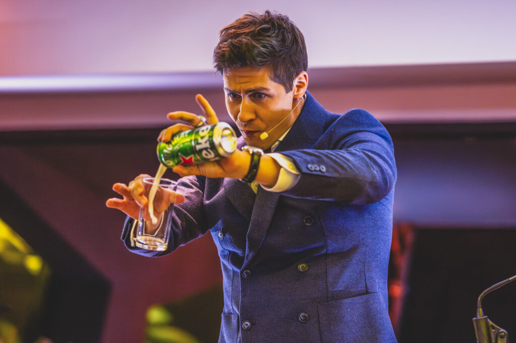 Magician Ben Hanlin performs a trick to a corporate audience at Norwich City Football Club - Freelance Press Photography Norwich