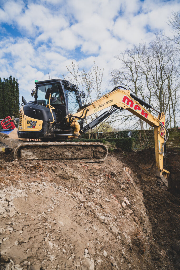 Groundwork Photography of AJT Contracting in Norwich working on a historical location using a large excavator