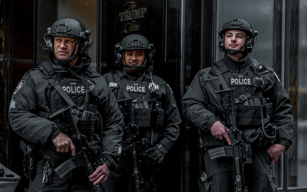 New York Street Photography of three armed Police Officers standing outside Trump Tower guarding the building