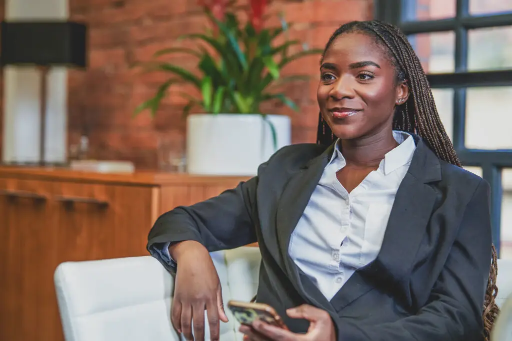 Female executive portrait, natural light, warm smile, professional services — business portrait photography London by Blanc Creative