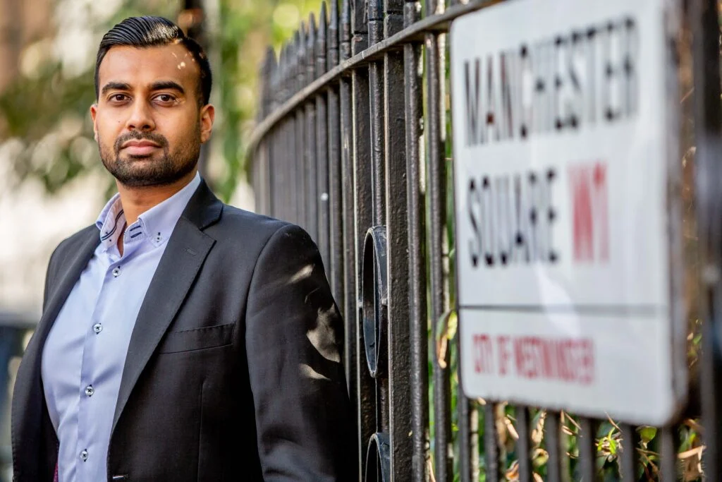 Male executive portrait outdoors, Manchester Square W1 street sign, London — location business portrait photography by Blanc Creative