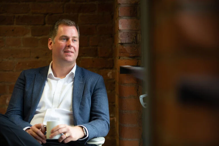 Male executive portrait, smart casual, natural light — professional headshot for wealth management firm by Blanc Creative
