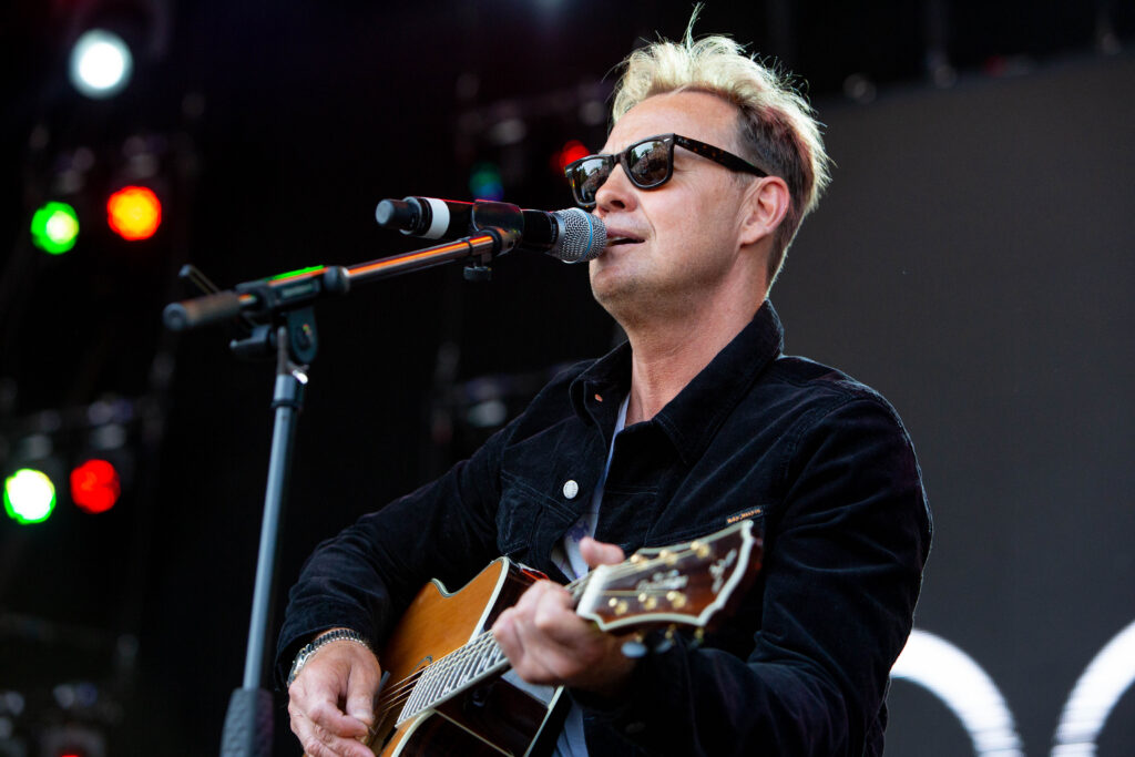 Who Owns Your Concert Photos - Jason Donovan performs in a pair of dark sunglasses