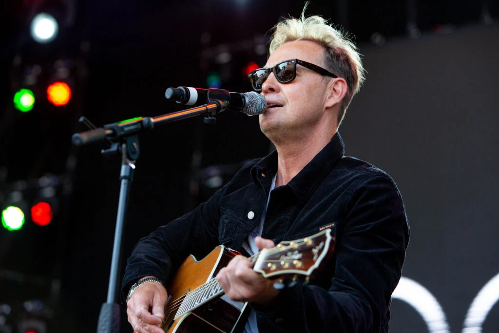 Who Owns Your Concert Photos - Jason Donovan performs in a pair of dark sunglasses