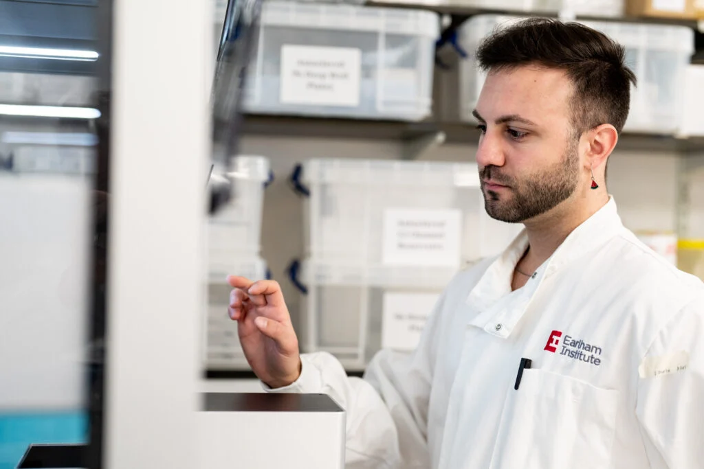 Corporate Headshots at Norwich Research Park - Male scientist portrait in a laboratory wearing white lab coat - Blanc Creative Norwich Portrait Photographer