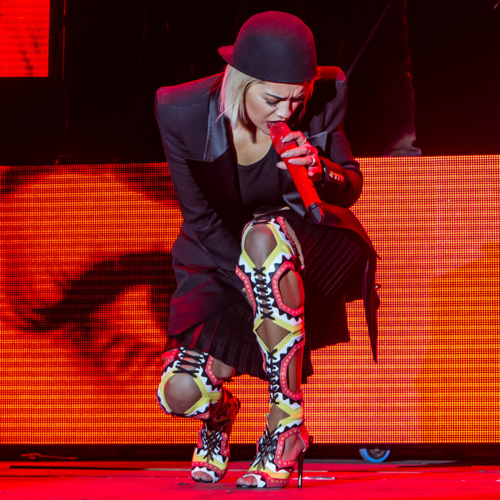 Who Owns Your Concert Photos. Rita Ora wears Thigh length boots on stage. Imagery - Norfolk Music Photography from Blanc Creative