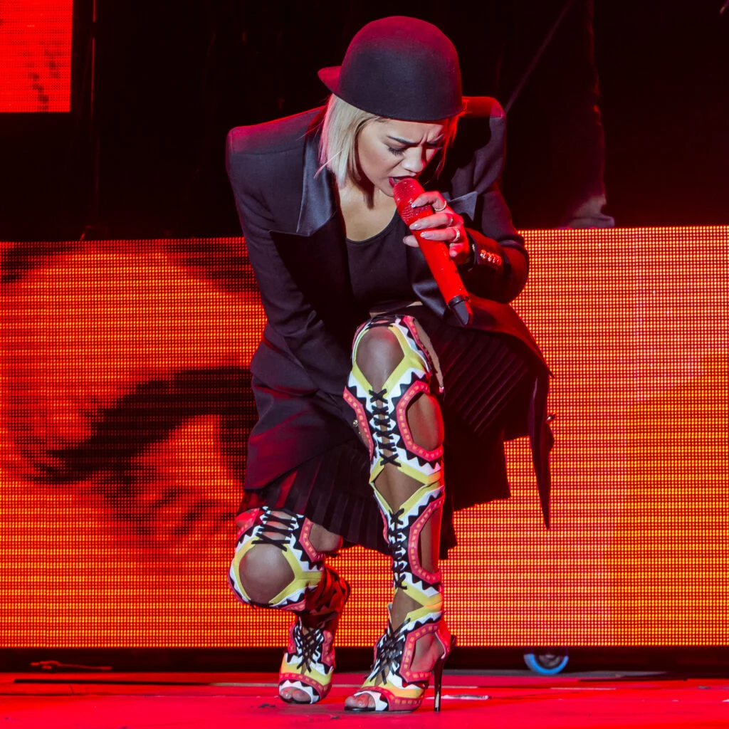 Who Owns Your Concert Photos. Rita Ora wears Thigh length boots on stage. Imagery - Norfolk Music Photography from Blanc Creative