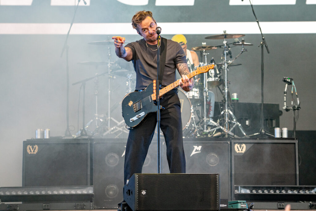 Blanc Creative Commercial Photography Norwich Lead image: Danny Jones of McFly at Forest Live Thetford 2026, High Lodge pointing to a cheering crowd - Norwich Music Photographer Lee Blanchflower