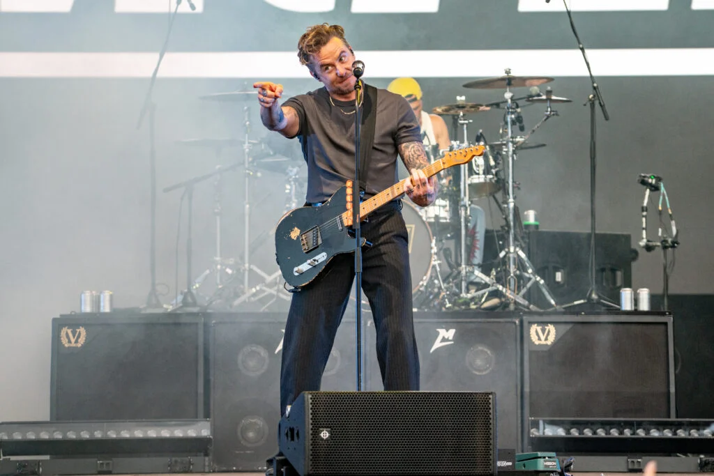 Lead image: Danny Jones of McFly at Forest Live Thetford 2026, High Lodge pointing to a cheering crowd - Norwich Music Photographer Lee Blanchflower